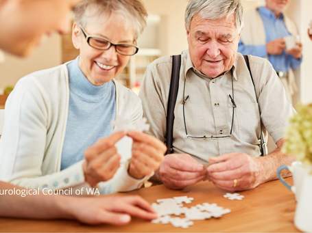 Lady and man working on puzzle 1