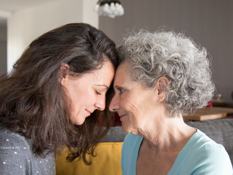 Mother daughter touching heads 3