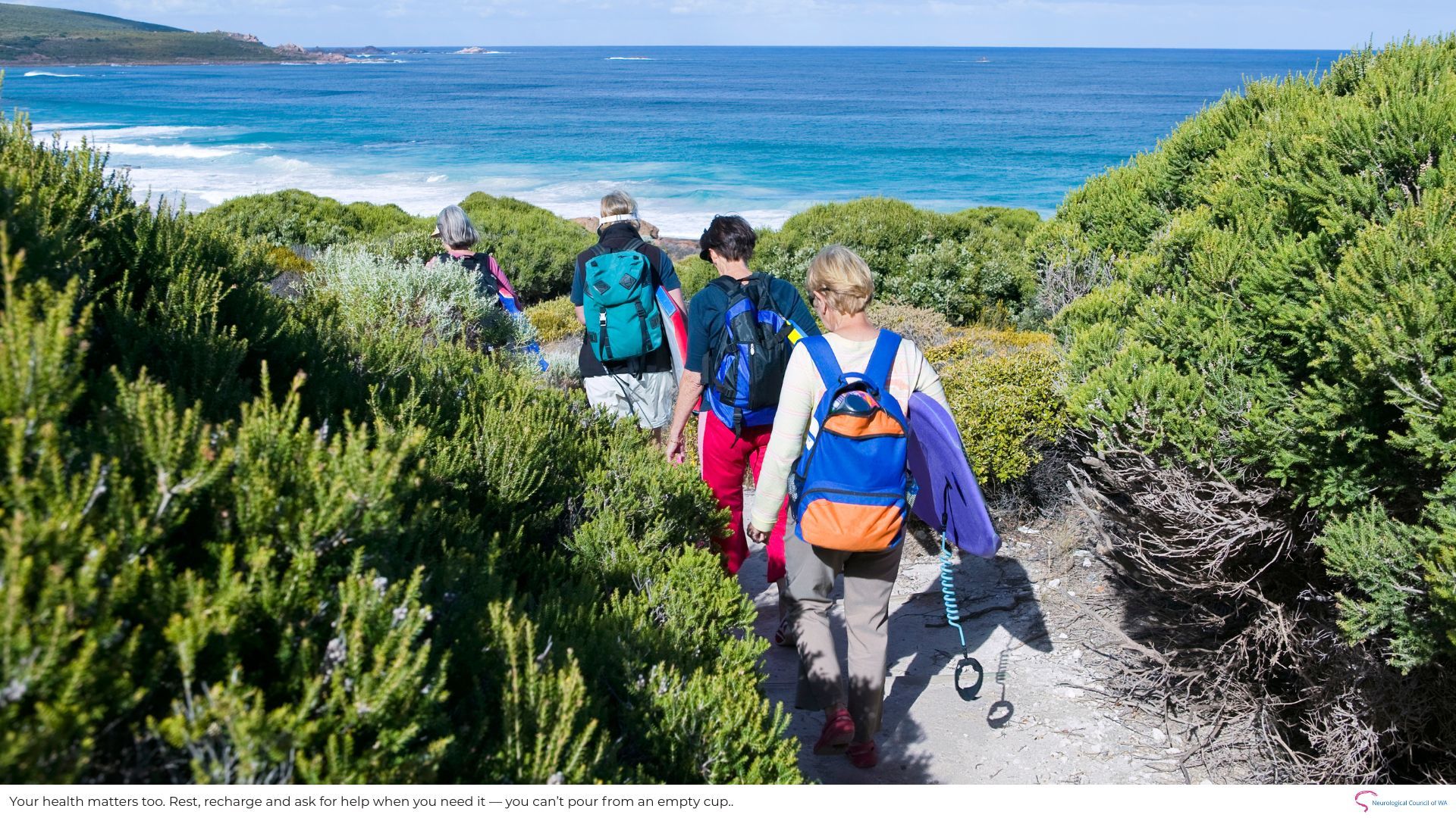 Ladies walking to beach along dune path